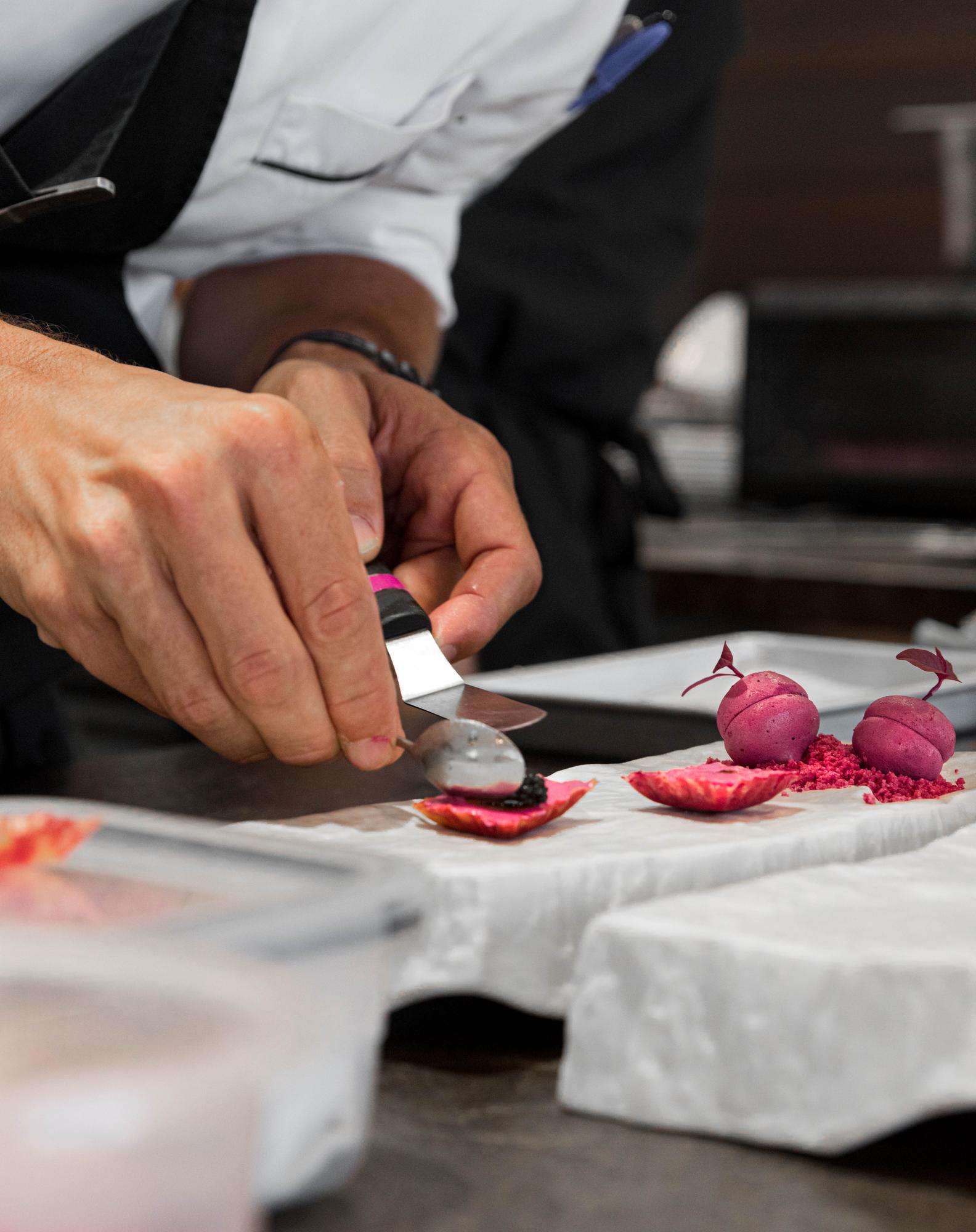 Chef demonstrating knife skills to participants